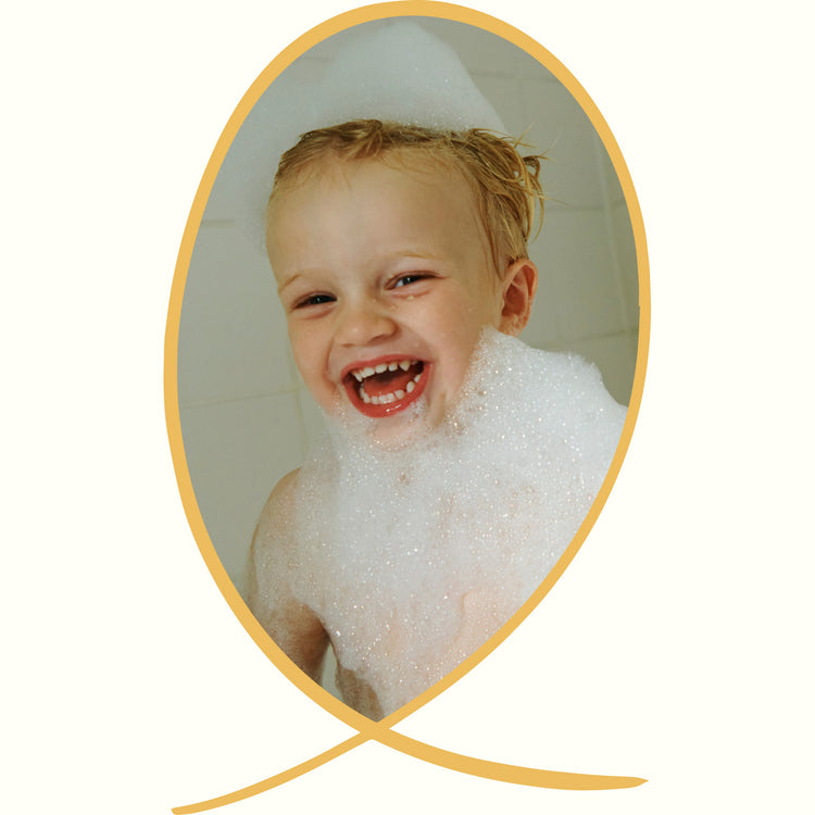 Boy laughing in bath