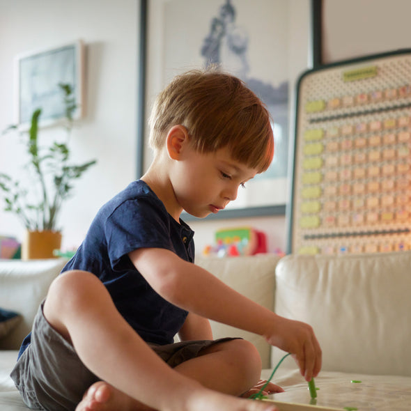 Boy interacting with toy